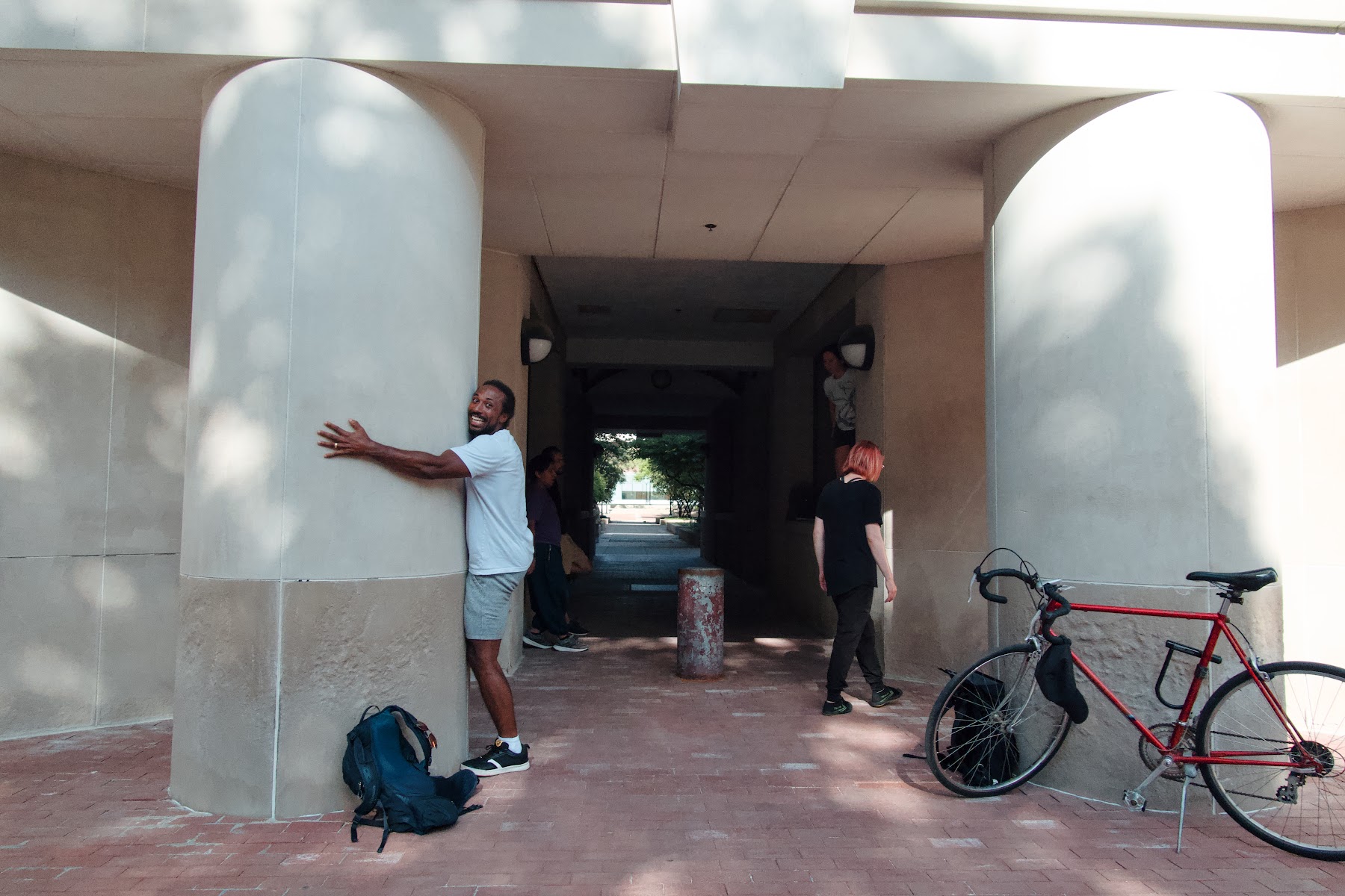 Michigan Parkour members training under campus columns